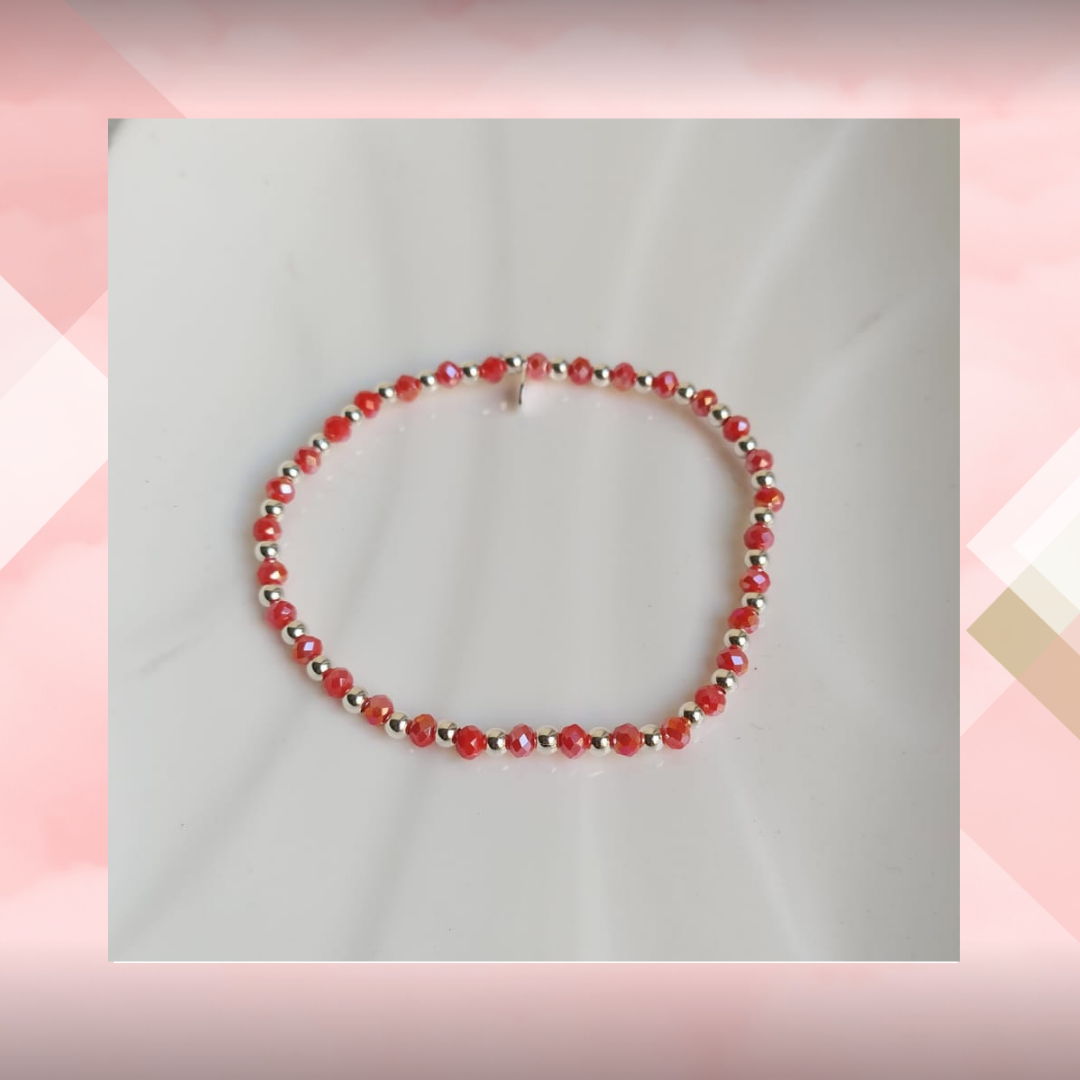 Pulsera elastizada cristal rojo con bolitas de plata. Plata 925